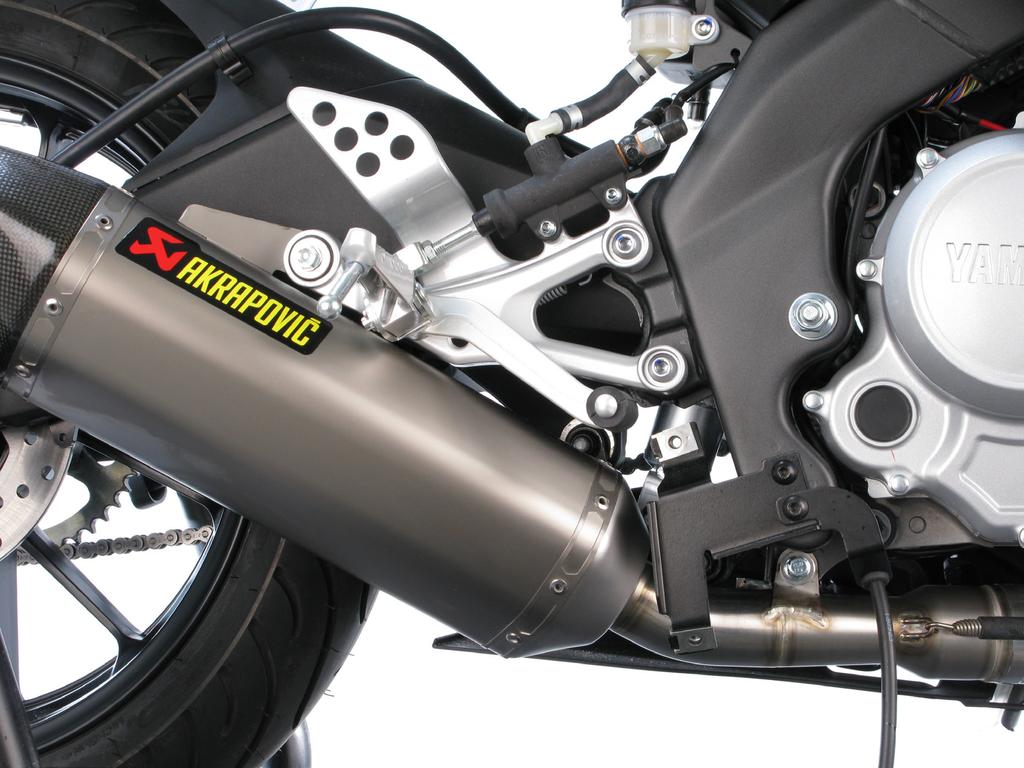 Slide the exhaust system onto the header tube, position exhaust system correctly and hand tighten bracket bolts using Akrapovič bolts and washers.