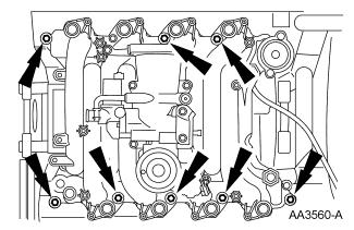 NOTE: Align the gasket locator tabs to slots in cylinder head. Install new intake manifold gaskets. 57.