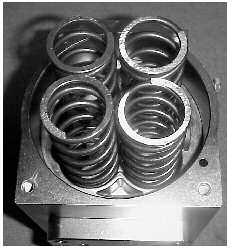 The air connection plate (6) can be removed from the body if necessary by unscrewing the two cap head bolts. 9. Remove o-rings and support rings from the piston heads 10.