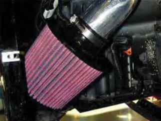 v. Place the air filter onto the end of the intake pipe and