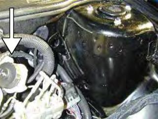 q. Remove the washer bottle/airbox assembly from the vehicle.