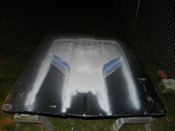 The hood is mostly flat so I sprayed on some cheap primer for protection and
