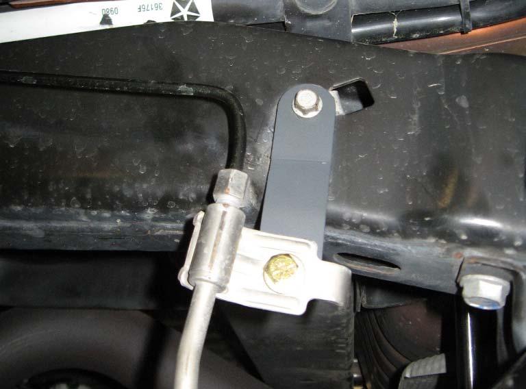 16 X 1 bolts and hardware. 5. Use the (2) holes in the support leg of the track bar bracket as a guide to center punch and drill the mounting holes in the axle upper control arm mount.
