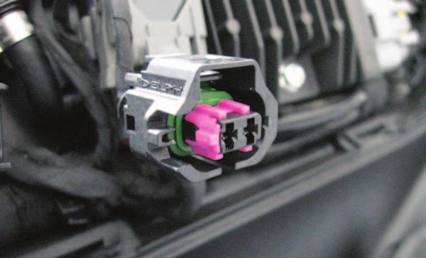 E 12. There is a small plastic PURPLE slotted guide inside of the stock Ignition Coil connectors that will need to be removed in order to