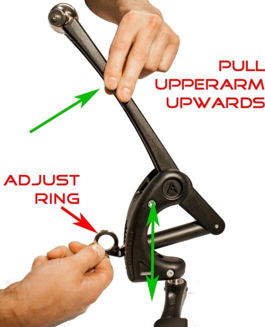 Adjust the level of weight compensation by following these steps: 1. Pull the upperarm upwards in the direction of the green arrow. 2.