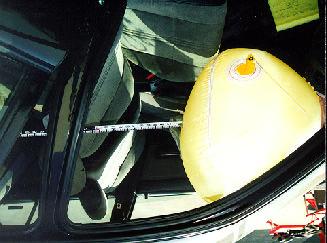 The dual module covers opened in a H-configuration and were not damaged. The maximum post deflated excursion measured 38.5 cm (15.2 in.). The driver s airbag had makeup transfer on the left-mid area.