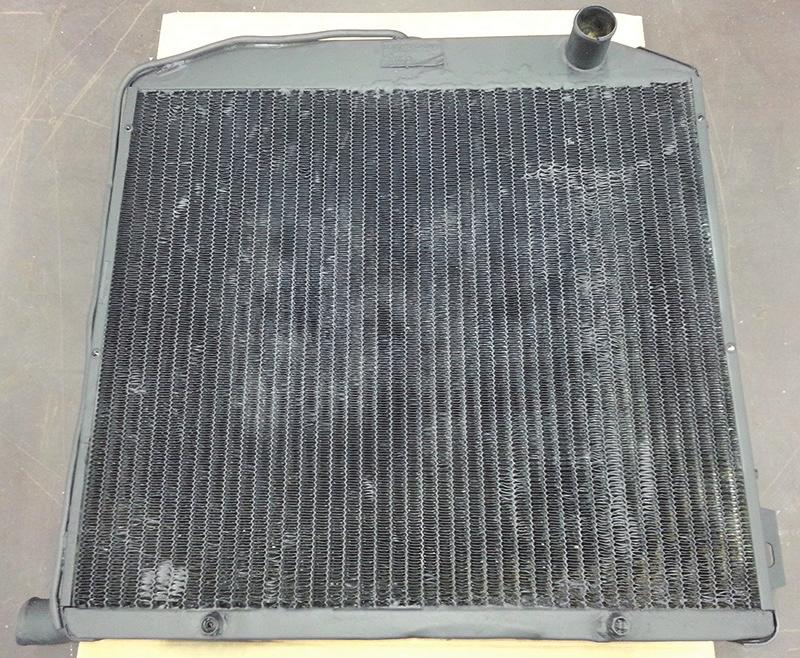 Radiator Modification. Place fan shroud assembly on top of radiator.