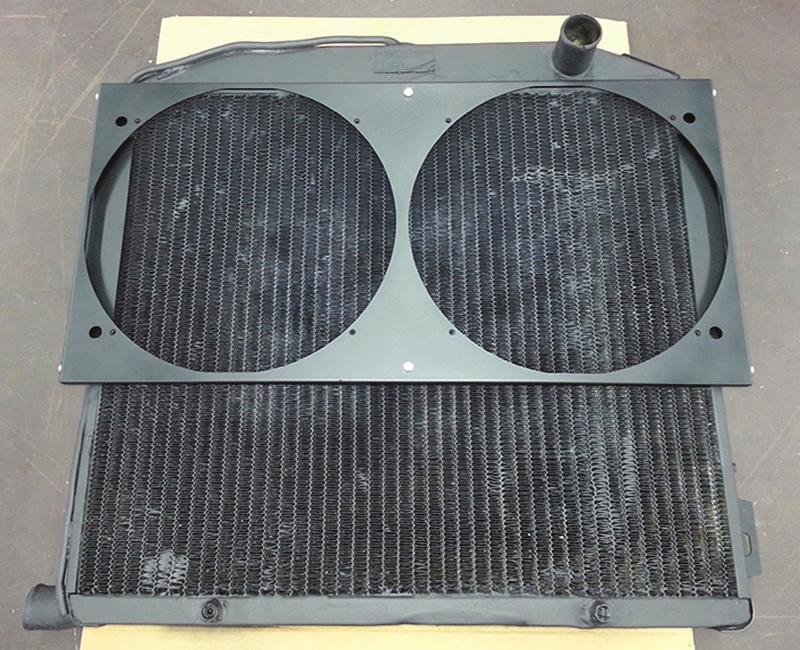 Remove fan shroud assembly and drill.50 (#25) holes through center-punched or scribed marks on radiator side flanges.