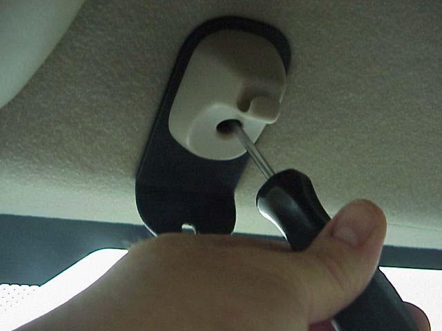 4). Attach the inner bracket and retaining clip to the headliner