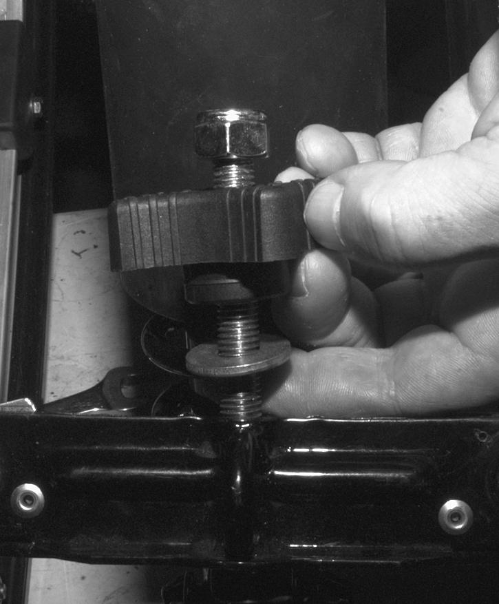 Elastic nut Route straps over and pass them through brackets of front arm upper axle, as shown on the next photo.. Washer. Adjuster knob.