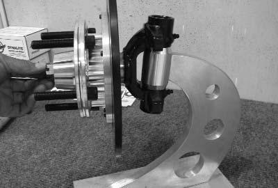5) Install hub assembly onto spindle, insert outer wheel bearing, retaining washer, and spindle nut.