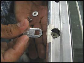 Carefully remove the screw, lock washers and lock strike from the back of the lock assembly. Refer to figure (C) 6. If necessary, replace the strike.
