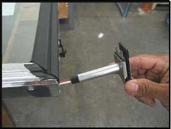 3. Pull the hinge pin out of the door frame until the pin and the wires are completely removed. Refer to figure (A) 4.
