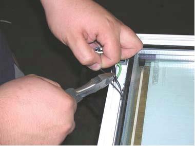 6. Carefully pull power wires from the door rail and locate the glass-pack heater wires. Refer to figure (A) A 7. Open each terminal housing, exposing the wire connections. 8.