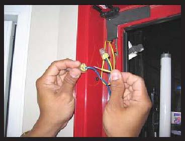 Using wire cutters, cut the wires at the connection to the lamp socket. 8. Remove the socket from the frame and discard it. 9.