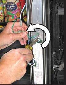 Using a phillips-head screwdriver, loosen the screw securing the lower portion of the ballast to the raceway. Refer to figure (D) \ C D 7.
