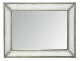 Wood-framed mirror with non-beveled mirror glass. Outer border of frame has antiqued mirror glass. Can be hung vertically or horizontally. Gray Cashmere finish.