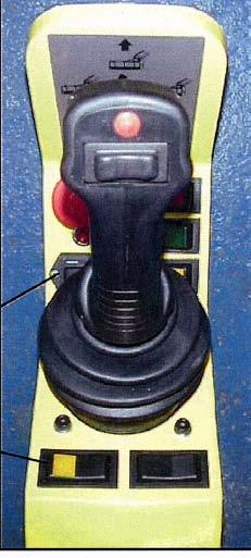 Hydraulic rear roller control switch. Positions depend on machine options specified.