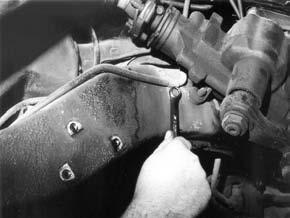 Disconnect the brake line clamp by the