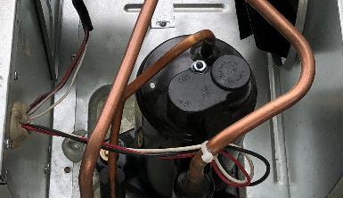 Identifying the wires The blue arrow to the left points to the top of the compressor.