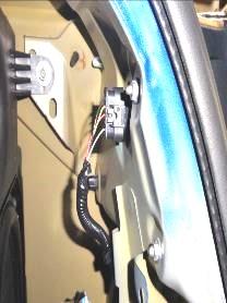 Remove (1) plastic rivet on driver side of the vehicle.