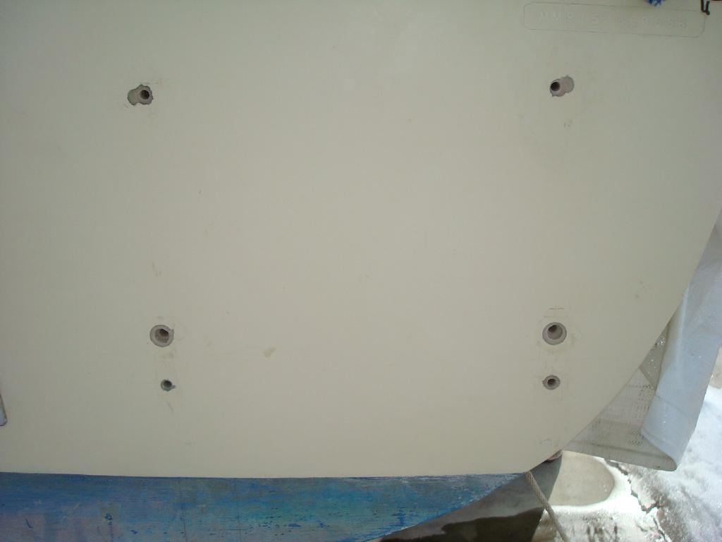 I didn't do a good job with my initial placement of the top holes: I installed the ladder and drilled a hole through the deck to hull flange at the
