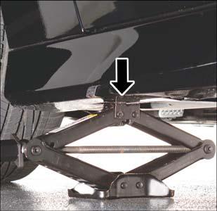 Turn the jack screw clockwise to firmly engage the jack saddle with the lift area of the sill flange.