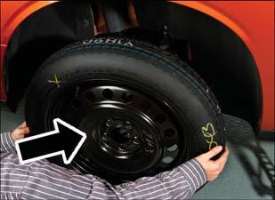 CAUTION! Be sure to mount the spare tire with the valve stem facing outward. The vehicle could be damaged if the spare tire is mounted incorrectly.