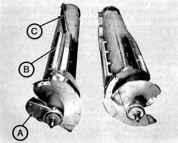 Concave Adjustment: Each rotor was equipped with a set of concaves (FIGURE 7), consisting of an adjustable threshing portion and a stationary separating portion.