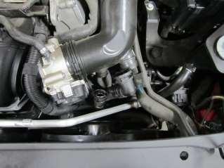 e) Release the pressure on the clamp at the throttle body and remove the stock intake tube.