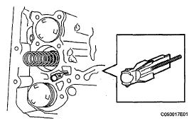 Fig. 113: Identifying Bolt And Lock Plate 7. REMOVE TRANSMISSION VALVE BODY ASSEMBLY a. Support the valve body and remove the 17 bolts and valve body.