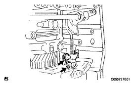 Fig. 249: Identifying Parking Lock Pawl Bracket Bolts 23. REMOVE MANUAL VALVE LEVER SHAFT RETAINER SPRING a.