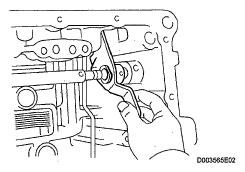 HINT: Slowly drive out the pin so that it will not fall into the transaxle. Fig. 252: Identifying Tapping Out Manual Valve Lever Shaft Spring Pin c.