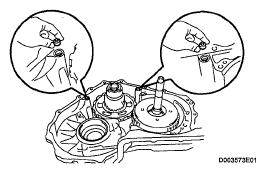 Remove the 2 overdrive brake gaskets from the transaxle.