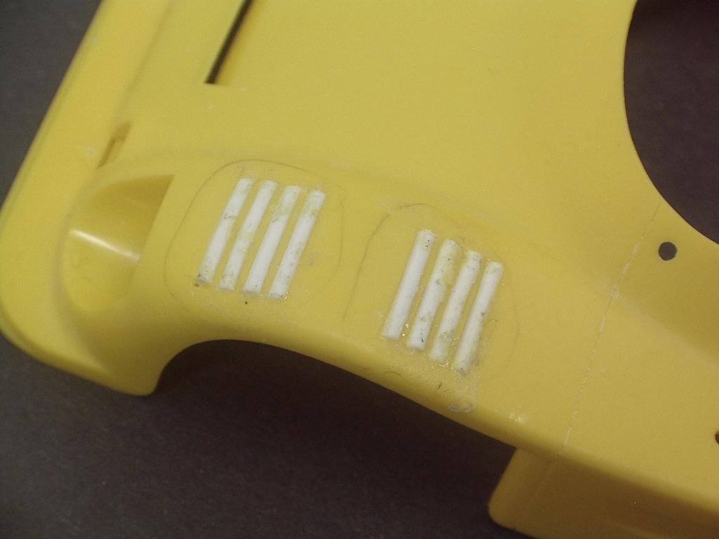 Figure 3 Vents on top of fenders A razor saw was used to cut away most of the secondary rear scoop. The slot was filled with 2.0 mm (0.080 ) x 6.4 mm (0.