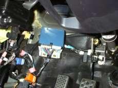 4. Remove the plastic nut from the driver s side kickpanel and remove