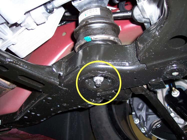 Undo the 2 nuts per bracket to detach the sway bar from the subframe.