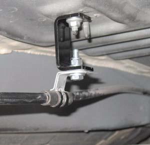 Install kit bracket (parking brake) and nut to underside of body. Install park brake cable bracket, kit bolt (1/4 x 1 ), two kit washers (1/4 SAE), and kit nut (1/4 nylock).