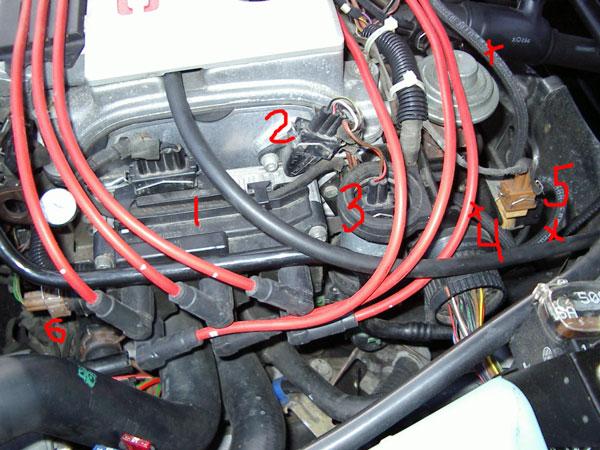 PIC4: so this is the shot where you can see the coil pack and a bunch of vacuum lines. I marked just a few with x's, someone wrote they couldn't see any.