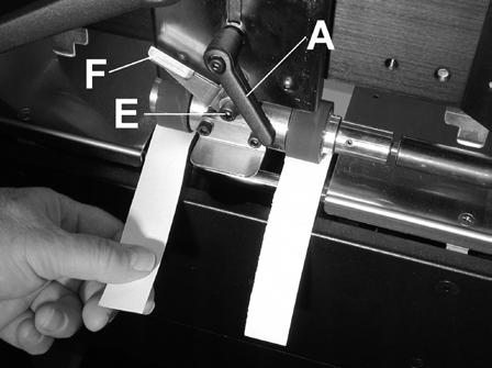 paper under the Upper Forwarding Rollers. Then lower the Rollers using the Media Thickness Knob [C] until one of the strips has a slight drag in it. 3.