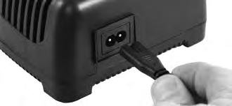 Figure 4 Inserting Power Cord 5. Insert power cord into charger (Figure 4). Confirm securely installed. 6. This charger is provided with a keyhole hanging feature if wall mounting is desired.