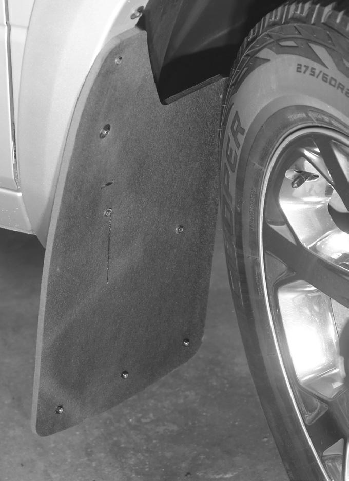 Level mud flap while adjusting in and out to obtain best fit then tighten factory screw to hold in place.