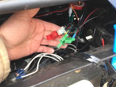 Route the cable between the steering column and the tilt mechanism then up under the