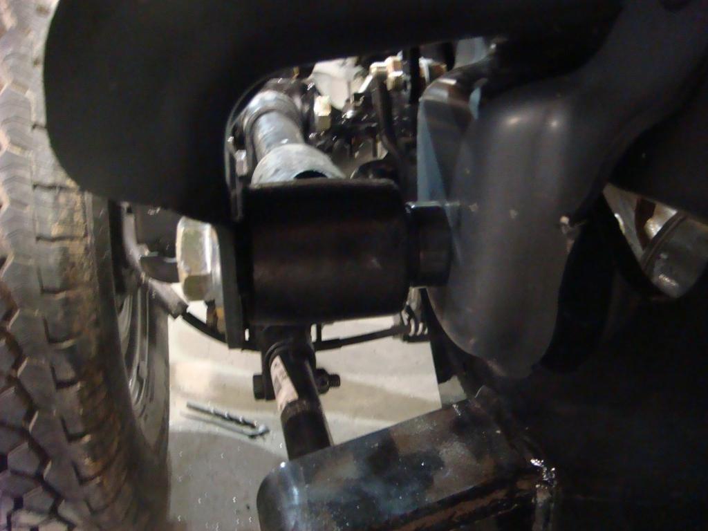 On the other end of the trailing arm, use the 7/8 x 5 bolts. Make sure that the 7/8 x 5 bolt is inserted inside out. Do not tighten the 7/8 bolts until after step 18.