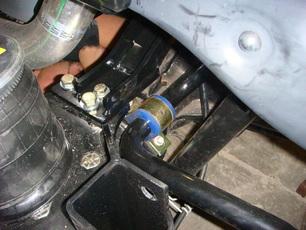 9. Locate the pan hard bar lower mount (axle cross member) (part # 50617). The tall part goes on the drivers side.