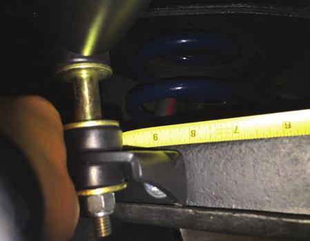Hold the end of the tape measure against the outer edge of the Control Arm Bushing and make a mark on the Control Arm at 8.