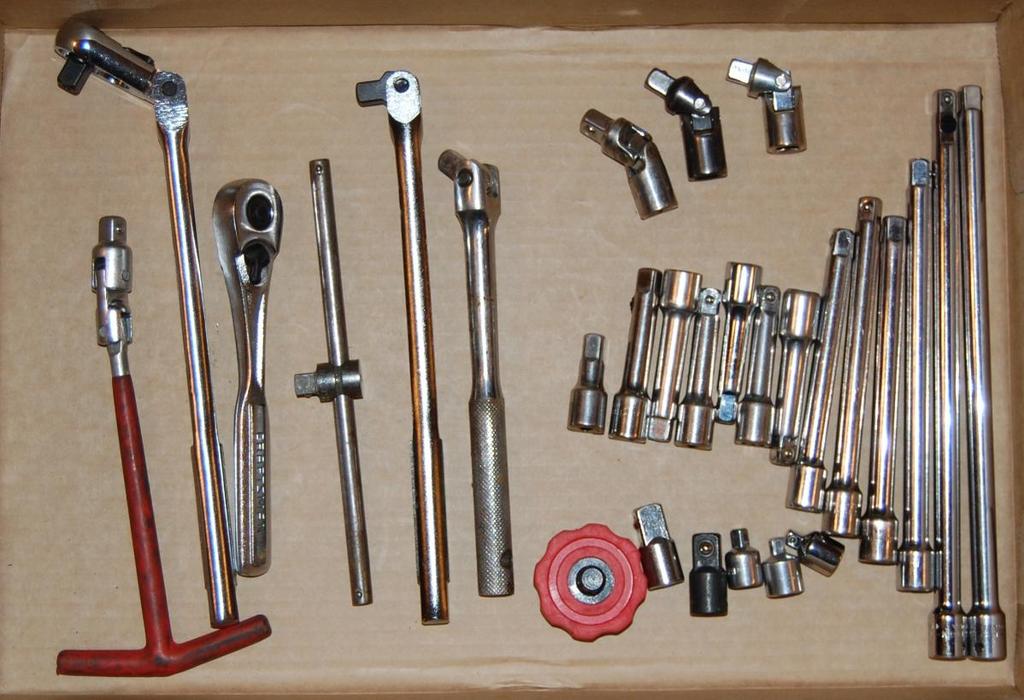 Left to right: spark plug socket driver, Craftsman flex-head ratchet, Craftsman ratchet, Craftsman sliding T-handle, Craftsman breaker bar, and an Autozone breaker bar.