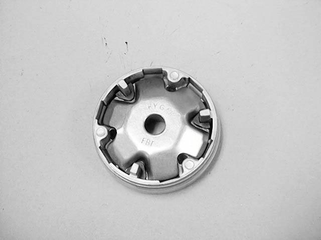 DRIVE PULLEY REMOVAL Hold the drive pulley with the holder and remove the 12mm drive face nut. Remove the starting ratchet, 12mm washer and drive pulley face.