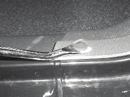 Using a panel removal tool remove the four plastic retainers (three in front door opening and one in rear door opening) securing the driver s side sill plate and B pillar post cover. Fig. 9 16.