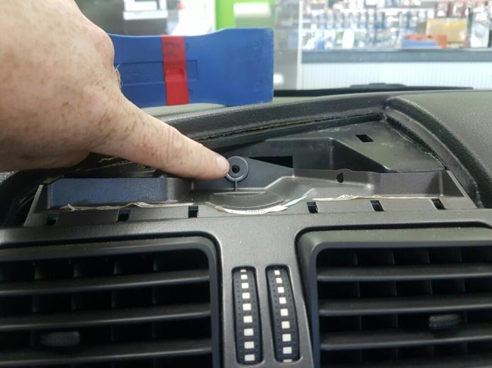 Step 5. (Figure 5) Remove the top bolt/screw above the air con vents Step 6.
